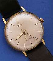 LACO HERRENARMBANDUHR, DEUTSCHLAND UM 1960, GG 585/000, BODEN GEDR., HANDAUFZUG, 21 ST., DUROWE KAL. 440, SCHR.-UNR., FLACHSPIR., ...
