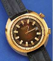 WAKMANN ARMBANDWECKER, SCHWEIZ UM 1970, METALL HARTVERG., EDELST.-BODEN GESCHR., BLATT M. EXTR. ERH. STD.-ZEICHEN, ZENTR.-SEK.,DATUM, 17 ...