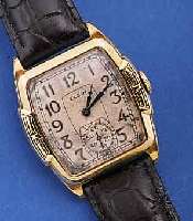 ELGIN HERRENARMBANDUHR, USA UM 1929, GG- FILLED, AUFWEND. TONNENFORM, ORIG.-BLATT FL., GEBL. ORIG.-STILFORMZEIGER, 15 ST., HANDAUFZUG, ...