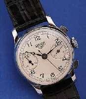 HEUER ARMBANDCHRONOGRAPH, SCHWEIZ UM 1940, EDELST., BODEN U. GLASR. GEDR., BLATT REST., 30-MIN.-STOPPZäHLER, 17 ST., HANDAUFZUG, SCHR.-UNR., ...