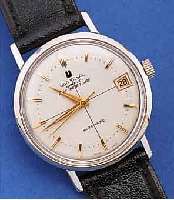 UNIVERSAL GENEVE POLEROUTER DATE AUTOMATIK, SCHWEIZ UM 1964, EDELST., BODEN GESCHR., 28 ST., KAL. 218-2, GLYC.-UNR., FLACHSPIR., INCABL., ...