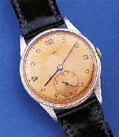 EBEL HERRENARMBANDUHR, SCHWEIZ UM 1940, METALL NACHVERCHR., EDELST.-BODEN U. GLASR. GEDR., KUPFERFARB. BLATT FL., ORIG. GEBL. STAHLZEIGER, ...