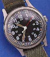 HAMILTON MILITäRARMBANDUHR, FüR DIE US- ARMY, 1977, EDELST. LACK., EINSCHALENGEH., GET. A-WELLE, BEI FERTIGST. WASSERGESCH., TEXTILBAND ...