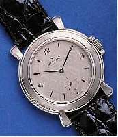 MOVADOMOVADO HERRENARMBANDUHR, SCHWEIZ UM 1995, UNGETR. LAGERW., LEDERB., ORIG.-ETUI, EDELST. POL., TEILW. SAT., STILTYP. 40ER JAHRE, FLACHE ...