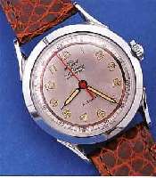 MASCOT ARMBANDUHR, AUF BLATT HUFEISENSYMB., SCHWEIZ UM 1954, METALL VERCHR., EDELST.-BODENGESCHR., AUTOMATIK, ZENTRALROTOR, 17 ST., BASISKAL. ...