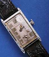 OLLENDOROLLENDORF HERRENARMBANDUHR, SCHWEIZ/USA UM 1930, METALLGEH. VERN., RECT.-FORM, LÜNETTE U. SEITL. SCHMUCKGEPR., AUßER LEDERB. ORIG.- ...