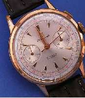 DELBANA ARMBANDCHRONOGRAPH, SCHWEIZ UM 1958,METALL ROTVERG., BER., EDELST.-BODEN U. GLASR.GEDR., 30-MIN.-STOPPZäHLER, AUßENSKALEN FARBL.DIFF., 17 ...