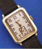 GRUEN HERRENARMBANDUHR, SCHWEIZ/USA UM 1936, GG-FILLED, BLATT ALTERSBED. L. FL., 15 ST., HANDAUFZUGKAL. 705, KOMP.-UNR., GEBL. BREG.-SPIR., ...