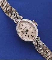 BENRUS DAMENSCHMUCKBANDUHR, SCHWEIZ/USA UM 19625, WG-FILLED GEH., AN DEN BANDANST. JE 2 DIAMANTEN, BODEN GEDR., VERS. BLATT, ZUM RAND ZU L. ...