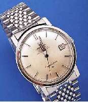 OMEGA HERRENARMBANDUHR AUTOMATIK CONSTELLATIONIN CHRONOMETERQUALITäT, EDELST., BODEN GE- SCHR., BLATT VERS., STD.-ZEICHEN M. ONYXEINL.,WERK VERG., ...