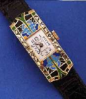 DAMENARMBANDUHR ART DECO, SCHWEIZ UM 1934, GG 750/000, RECT., SCHARNIERB., SCHöNE EMAIL- ARB., LüNETTE U. SEITL. SCHMUCKGEPR., TEILVER-D. ...