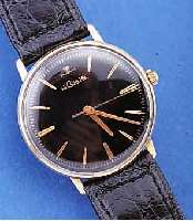 LE COULTRE HERRENARMBANDUHR, SCHWEIZ/USA UM 1965, GG-FILLED, EINSCHALENGEH., GET. A-WELLE,BEI FERTIGST. WASSERGESCH., BLATT REST., RUNDANKERW., ...