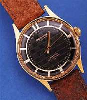 RODANIA HERRENARMBANDUHR, SOGEN. COCKTAILS- WATCH, SCHWEIZ UM 1954, FRüHE BEIDS. VERGL., METALL HARTVERG., STD.-ZIFFERBL.-BER. ROT UNTERL., 17 ...