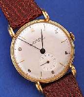 GLYCINE HERRENARMBANDUHR, SCHWEIZ UM 1948, FLACHES GG 750/000-GEH., BODEN GEDR., AUFWEND.AUFGES. U. GEST. BANDANST., BLATT REST., RUNDANKERW., ...