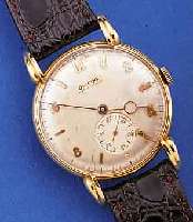 GLYCINE HERRENARMBANDUHR, SCHWEIZ UM 1948, FLACHES GG 750/000-GEH., BODEN GEDR., AUFWEND.AUFGES. U. GEST. BANDANST., ZIFFERBL. FL., RUNDANKERW., ...