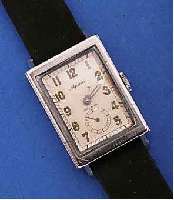 ALPINA HERRENARMBANDUHR, IM FRÜHEN, WASSER- D. RECT.-GEH., EDELST., AUFWEND. VERARB., BEIDE HALBSCH. WERDEN SEITL. DURCH SCHWALBEN- SCHWANZFÖRM. ...