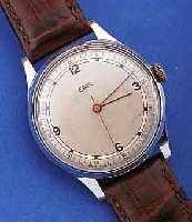 EBEL HERRENARMBANDUHR, SCHWEIZ UM 1945, METALL VERCHR., EDELST.-BODEN U. GLASR. GEDR.,AUßER LEDERB. U. KRONE ORIG.-ZUST., D. CA. 35 MM, ...