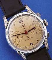 MULCO ARMBANDCHRONOGRAPH MODELL PRIMA, SCHWEIZ UM 1942, METALL VERCHR., EDELST.-BODENU. GLASR. GEDR., VERS. ORIG.-BLATT, ALTERSBED.FL., ...