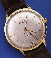 GRUEN HERRENARMBANDUHR AUTOMATIK, SCHWEIZ UM1960, GG 750/000 EINSCHALENGEH., GET. A-WELLE,BEI FERTIGST. WASSERGESCH., VERS. BLATT, 21 ST., ...