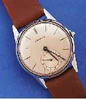 MOVADO HERRENARMBANDUHR, SCHWEIZ UM 1940, EDELST., BODEN U. GLASR. GEDR., VERS. BLATT, ZUM RAND ZU L. FL., GEBL. STAHLZEIGER, 15 ...