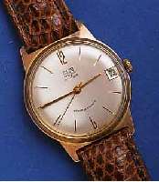 GUB HERRENARMBANDUHR, DEUTSCHLAND UM 1964, METALL VERG., BER., EDELST.-BODEN GEDR., ZEN- TRALSEK., DATUM, 17 ST., HANDAUFZUGKAL. 69,1, RINGUNR., ...