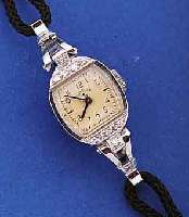 LADY ELGIN DAMENARMBANDUHR, PLATIN/IRIDIUM- GEH., USA UM 1950, LüNETTE SOWIE BANDANST. M. DIAMANTBES., BODEN GEDR., ORIG.-BLATT U. ZEI- GER, ...