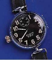 ELGIN FRÜELGIN FRÜHE FLIEGERUHR, USA UM 1917, METALL, SCHARNIERGEH. VERCHR., BEWEGL. BANDANST., ZUR BESSEREN ZEITABN. U. BED. KRONE AUßEN 9, KL. ...