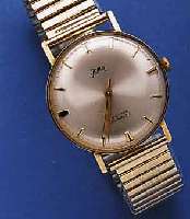 GAMA GAMA HERRENARMBANDUHR, SCHWEIZ/DEUTSCHLAND UM 1960, GG 585/000, EINSCHALENAUSF., FIXO- FLEX-GLIEDERB. SPÄTER, 17 ST., HANDAUFZUGKAL. VON ...
