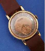 MOVADO HERRENARMBANDUHR, SCHWEIZ UM 1938, GG 750/000, BODEN U. GLASR. GEDR., KUPFERFARB. ORIG.-BLATT FL., KL. SEK. VERT., AUßER LEDERB. U. KRONE ...