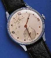 CYMA HECYMA HERRENARMBANDUHR, SCHWEIZ UM 1940, GR. METALLGEH. VERCHR., EDELST.-BODEN U. GLASR. GEDR., AUßER KRONE, GLAS U. BAND ORIG.-ZUST., ...