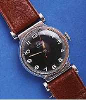 LACO HELACO HERRENARMBANDUHR, BRUCHSICHER, DEUT- SCHLAND UM 1939, ART DECO, KRUPP-EDELST., BO- DEN U. GLASR. GEDR., BEWEGL. BANDANST., LEDER- B. ...