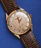 LONGINES HERRENARMBANDUHR AUTOMATIK, SCHWEIZ UM 1952, GG-FILLED, BODEN GEDR., ORIG.-BLATT ALTERSBED. FARBL. L. GET., 17 ST., ZENTRAL- ROTOR M. ...