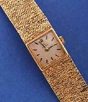 OMEGA DAMENGOLDBANDUHR, SCHWEIZ UM 1965, 9 CT. ROSE-G-GEH. INCL. BD., BOD. AUFGED., BL. VERS., ZUM RAND ZU LT. FLECKIG, FORMANKERW., KAL. 485, 17 ...