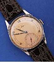 OMEGA HERRENARMBANDUHR, SCHWEIZ UM 1948, EDELST., BOD. U. GLASRAND AUFGED., 2FARB. VER- SILB. BL., KAL. 30T2, VERG., 15 ST., HAND- AUFZ., ...