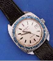 GLASHÜTTE HERRENARMBANDUHR SPEZIMATIC WORLD- TIMER, METALL, RECT., HARTVERCHR., BER., EDELST.-BODEN GEDR., DEUTSCHLAND UM 1970, LÜNETTE M. ...