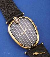 JAGUAR/REVUE THOMMEN DESIGNER HERRENARMBANDUHR GLEICHNAMIGER AUTOFIRMA, IN FORM EINES KÜH- LERGRILLES, METALL HARTVERG., EDELST.-BODEN GEDR., ...