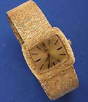 OMEGA ARMBANDUHRWERK HIER IM NEUTRALEN GG 585/000-GEHÄUSE INCLUSIVE GG-BAND, DESIGN VON BAND IN LÜNETTE ÜBERGEHEND, BODEN GEDR., NEUTR. ETUI, ...