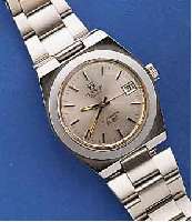 TISSOT HERRENARMBANDUHR, SCHWEIZ UM 1972, EDELST. INCL. ORIG. EDELST.-BOD., BOD. GESCHR. , DATUM MIT SCHNELLKORR. DURCH DRÜCKERKRONE, MOD. SERIE ...