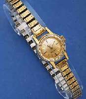 OMEGA DAMENARMBANDUHR, LADYMATIC, SCHWEIZ UM 1964, METALL, GG-AUFLAGE, BOD. AUFGEDR., ZEIT- IDENT. ZUGGLIEDERBD. M. GG-AUFL., VERS. BL., AUFGES. ...