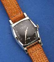 GRUEN HERRENARMBANDUHR VERY THIN, METALL, WG-AUFL., EDELST.-BOD. AUFGEDR., SCHWARZES KONTRASTZIFFERBL., SCHWEIZ/USA UM 1955, 17 ST. , HANDAUFZUG, ...