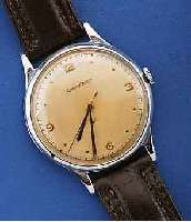 JAEGER LE COULTRE HERRENARMBANDUHR, SCHWEIZ UM 1948, EDELST., BOD. U. GLASRD. AUFGEDR., ORIG. BL. U. ZEIGER, LEDERBD. NEU, WERK VERN., 15 ST., ...
