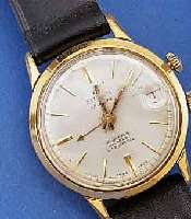 MILUS ARMBANDWECKER, SCHWEIZ UM 1955, METALL VERCHR., BER., EDELST.BOD. GESCHR., DAT., 21 ST., INCABL., GEH- U. WECKWERK, EINFEDERHAUS, BASISKAL. ...