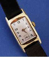 ARMBANDUHR, SCHWEIZ UM 1938, FÜR DEN DEUT. MARKT, GG 585/000, RECT.-FORM, SCHARNIERBOD. IN SICH LT. GEW., BL. REST., FORMANKERWERK V. FEF, 15 ...