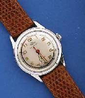MASCOT HERRENARMBANDUHR AUTOMATIK, UNGETR. LAGERW. UM 1956, FÜR DEN BRIT. MARKT IN AN- LEHNUNG AN DAS PFERDERENNEN, HIER M. HUFEISEN- AUFDR., ...