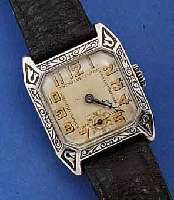HERRENARMBANDUHR, SCHWEIZ F. D. DEUTSCH. MARKT UM 1924, 935ER SILBER, RAND GEPRÄGT VER- ZIERT, BOD.-SCHARNIER IN SICH LT. GEW., ORIG. BL., ALTE ...