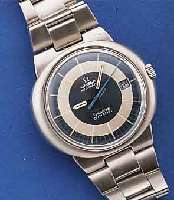 OMEGA HERRENARMBANDUHR, AUTOMATIK, SERIE DYNA- MIC, GENEVE, SCHWEIZ UM 1975, EDELST., EIN- SCHALENAUSF., GET. A-WELLE, EDELST.-BD. IM GEH.-BOD. ...