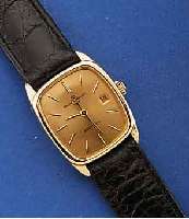 BAUME & MERCIER ARMBANDUHR, BAUMATIC, SCHWEIZ UM 1972, GG 750/000, MINERALFLACHGL., BOD. AUFGEDR., SCHMUCKKRONE, VERG. BL., LT. FLECKIG MIT LUPE ...