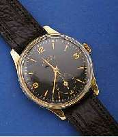 DOXA HERRENGOLDUHR, SCHWEIZ UM 1945, 14 CT. GG, BOD. U. GLASRAND AUFGEDR., ORIG. BL., ZEIGER ERSETZT, 15 ST., RUNDANKERWERK, KAL. 1, HANDAUFZUG, ...
