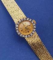OMEGA DAMENSCHMUCKBANDUHR, SCHWEIZ UM 1969, GG 750/000 GEH. INCL. GG FLECHTBD., LÜN. AUF- WEND. M. IN WG GEF. DIAMANTEN, ZUS 20 ST., BOD. ...