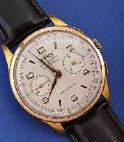 LANDERON ARMBANDCHRONOGRAPH, KAL.48, SCHWEIZ UM 1947, METALLGEH. VERG., BER., EDELST.-BOD. U. GLASRAND AUFGEDR., VERSILB. BL., TELE- U. ...